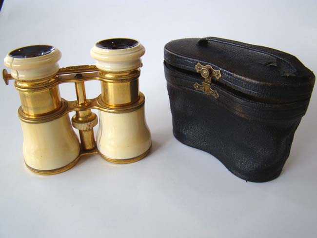 An ivory mounted pair of 19th century binoculars with settings for 'Field-Marine-Theatre'